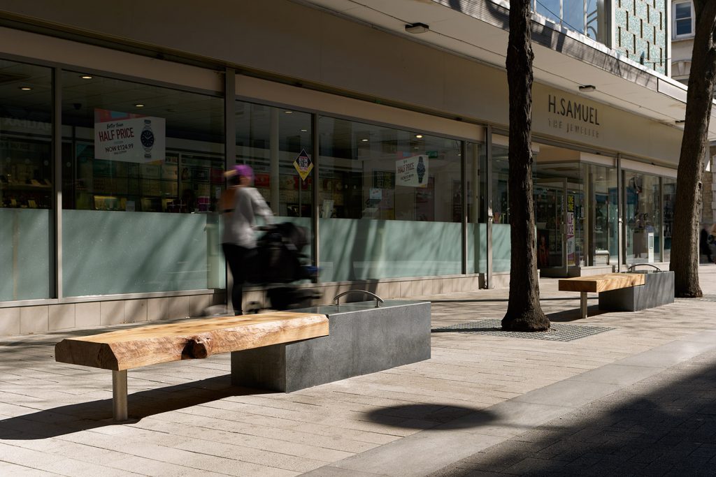 timber and granite bench in high street