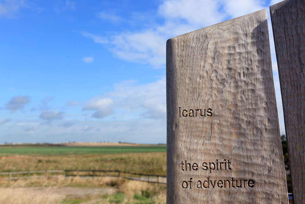 close up of sculpture with text that reads Icarus, the spirit of adventure.