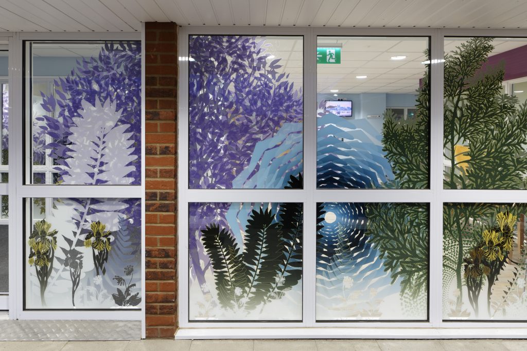 Colourful vinyls on glass windows photographed from the outside